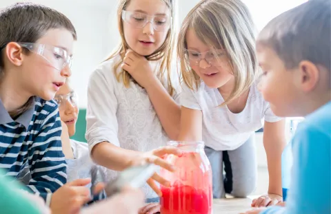 Kids watching science experiment